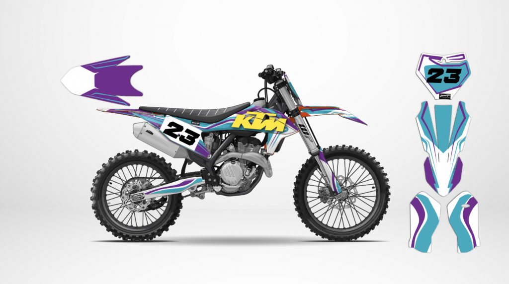 A KTM dirt bike with a custom purple, turquoise, and white graphics kit from Deviant Ink, showcasing number 23.