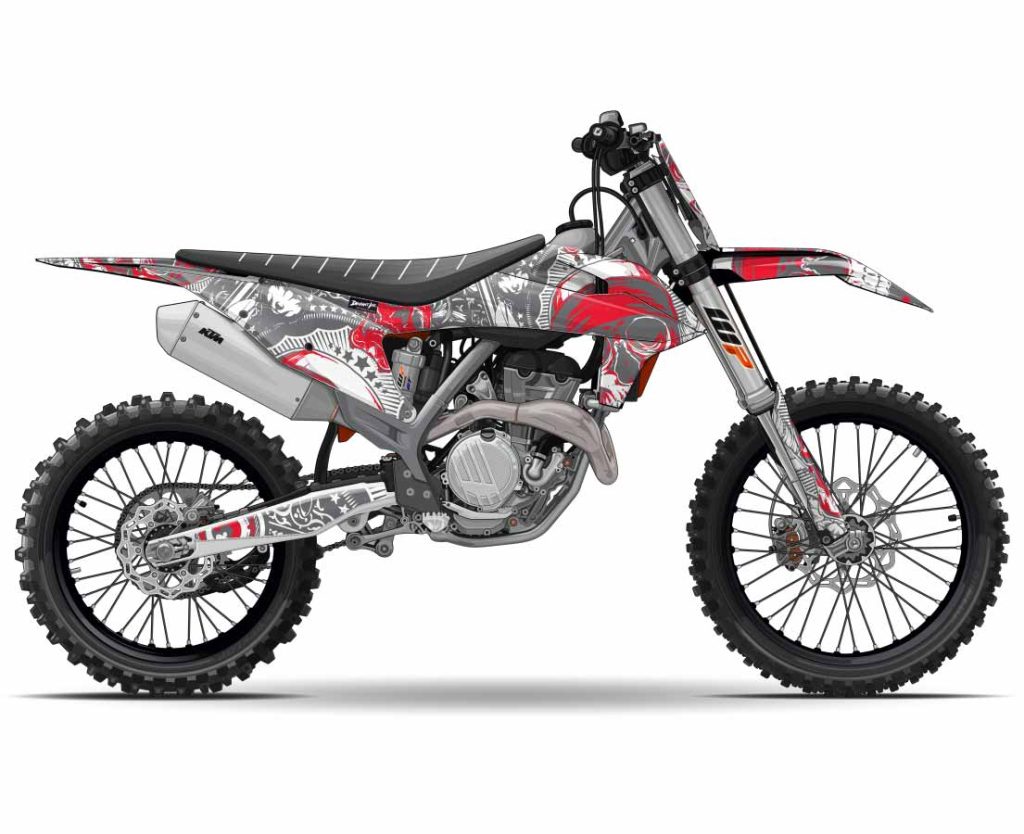 A KTM dirt bike with a custom red and gray sticker kit from Deviant Ink, built for performance and style.