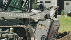 Close-up of custom-wrapped Bobcat T66 with Deviant Ink graphics for On Point Excavation