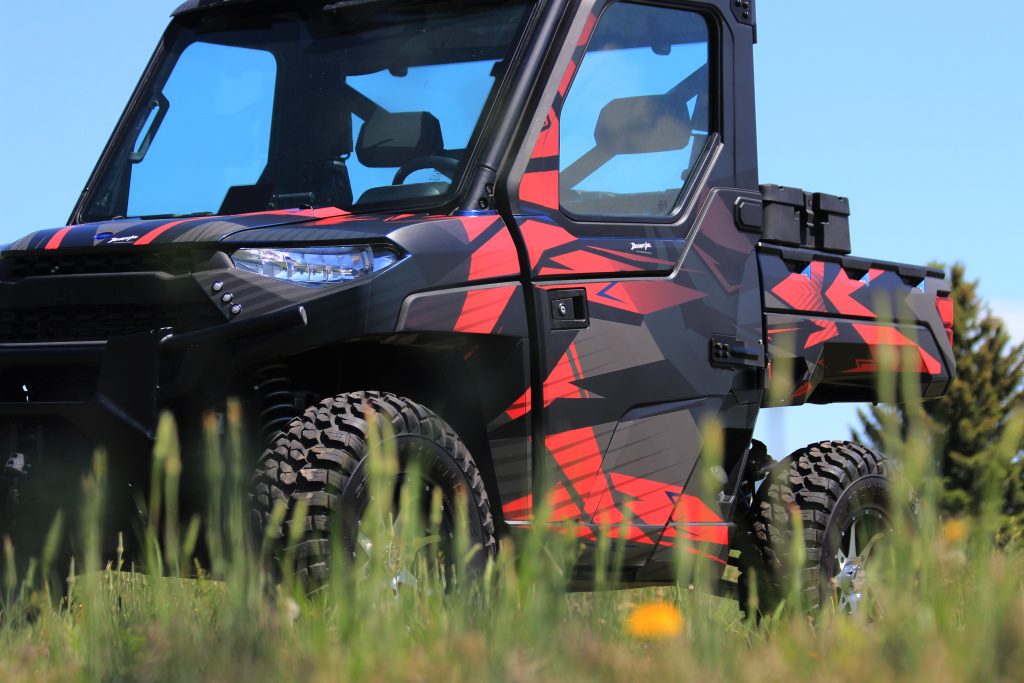 Polaris Ranger with custom Terminal wrap by Deviant Ink, featuring red and black geometric patterns