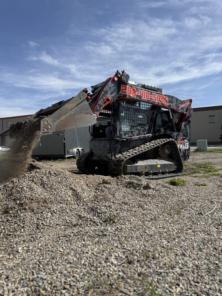 Kubota skid steer with custom true camo vinyl wrap by Deviant Ink